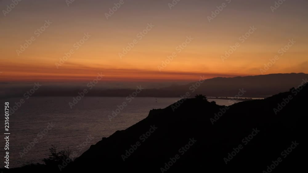Sunset dramatically silhouettes mountain seaside cliffs in the Marin Headlands Sunset dramatically silhouettes mountain seaside cliffs in the Marin Headlands