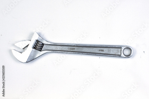 Silver metal spanner tool, isolated. © Celeste