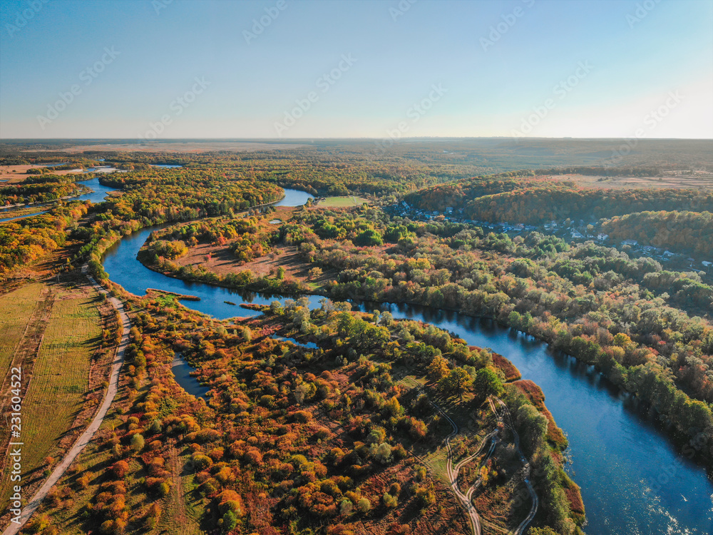 Cinematic aerial view, flight over a beautiful meandering river, panoramic view from a great height