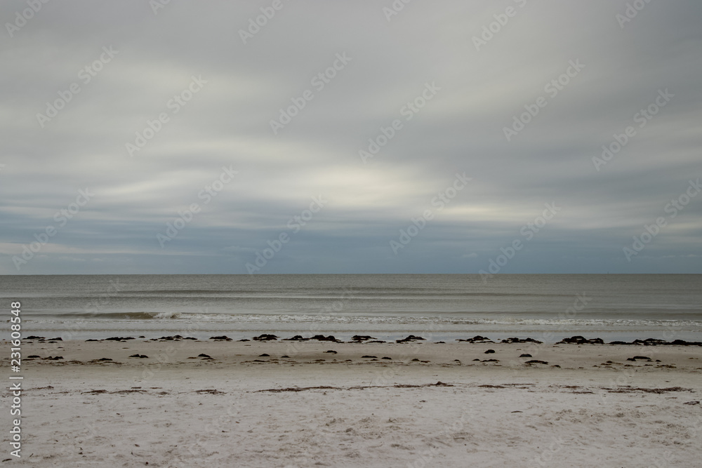 Horizon over Gulf of Mexico with beachfront view on stormy morning along Fort Myers Beach on Estero Island in Florida. Horizon over Gulf of Mexico with beachfront view on stormy morning along Fort Myers Beach on Estero Island in Florida.
