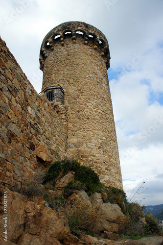 Spain.Tossa de Mar.One of the well-preserved towers of the fortress. photo