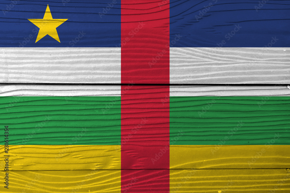 Flag of Central African on wooden wall background. Grunge Central African flag texture, blue white green yellow and red color with star.