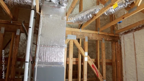 Closeup on termal insulation installing at the attic insulation of the house photo