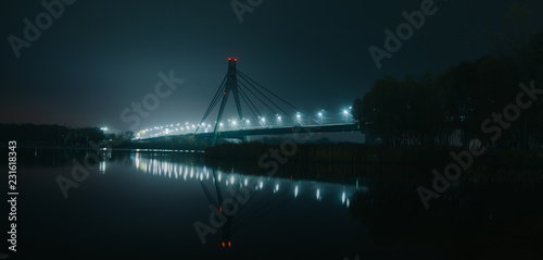 Moscow North bridge, night panorama on illuminated construktion with beautiful reflections in Dnipro river