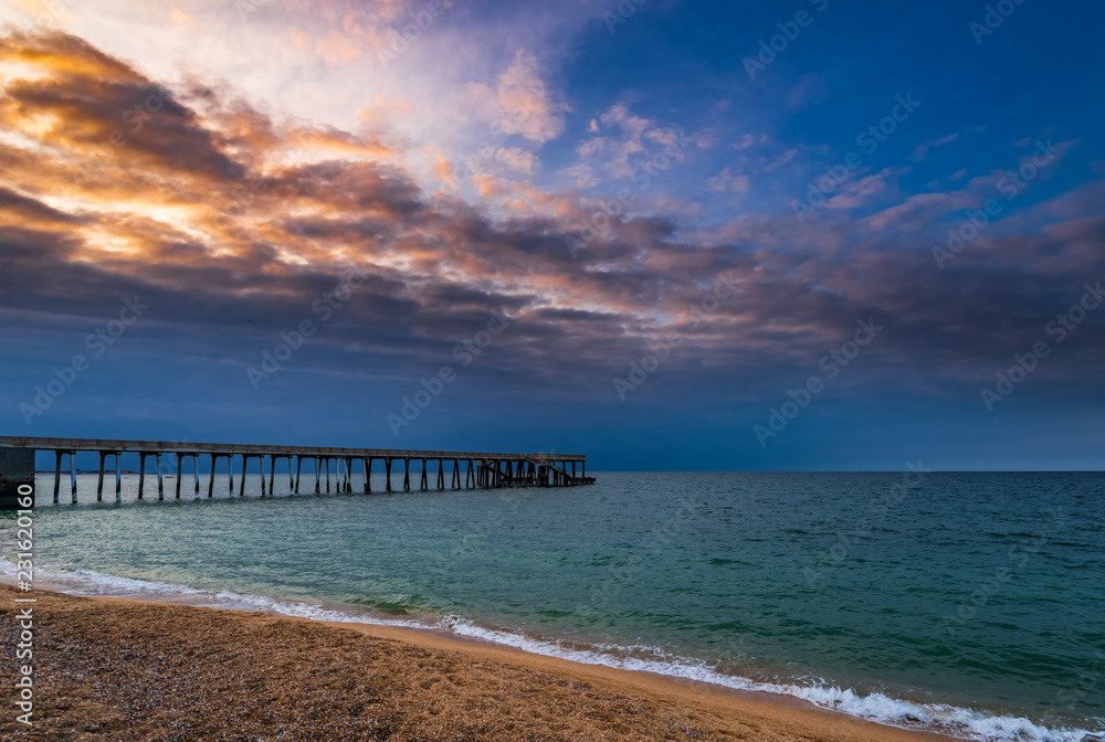 Sea pier at sunset time