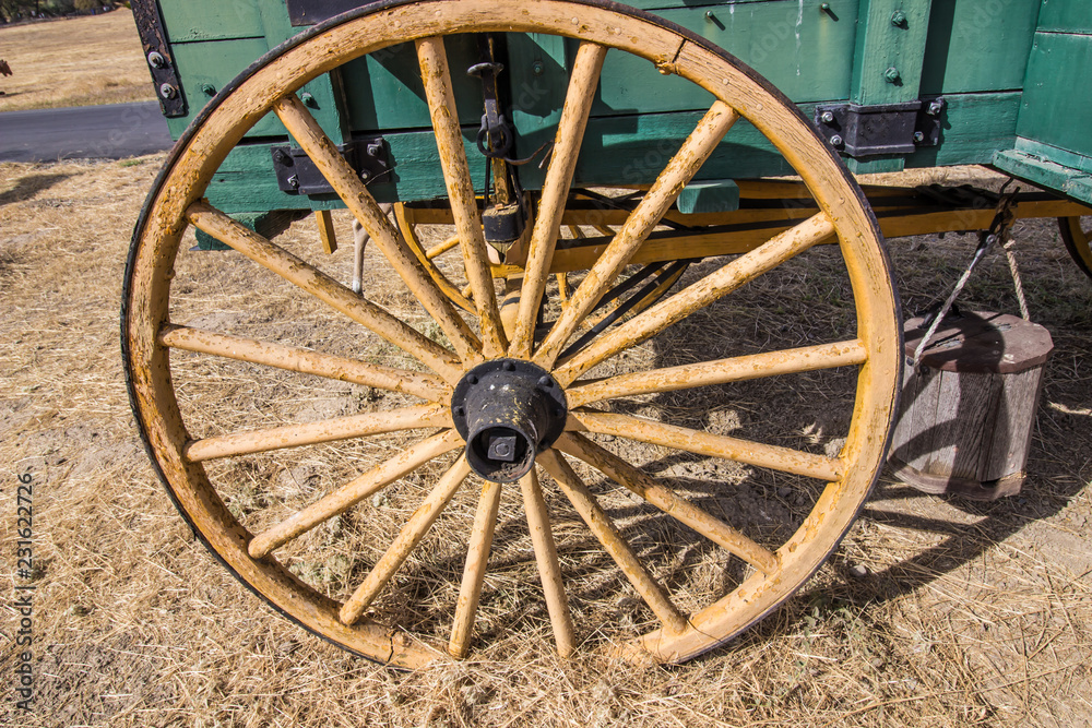 Old Weathered Wooden Wheel On Wagon