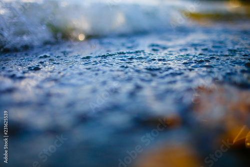 Water surface with bubbles macro texture. Selective focus