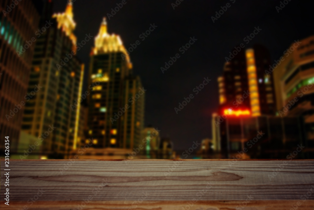 empty wooden tabletop on the night city background