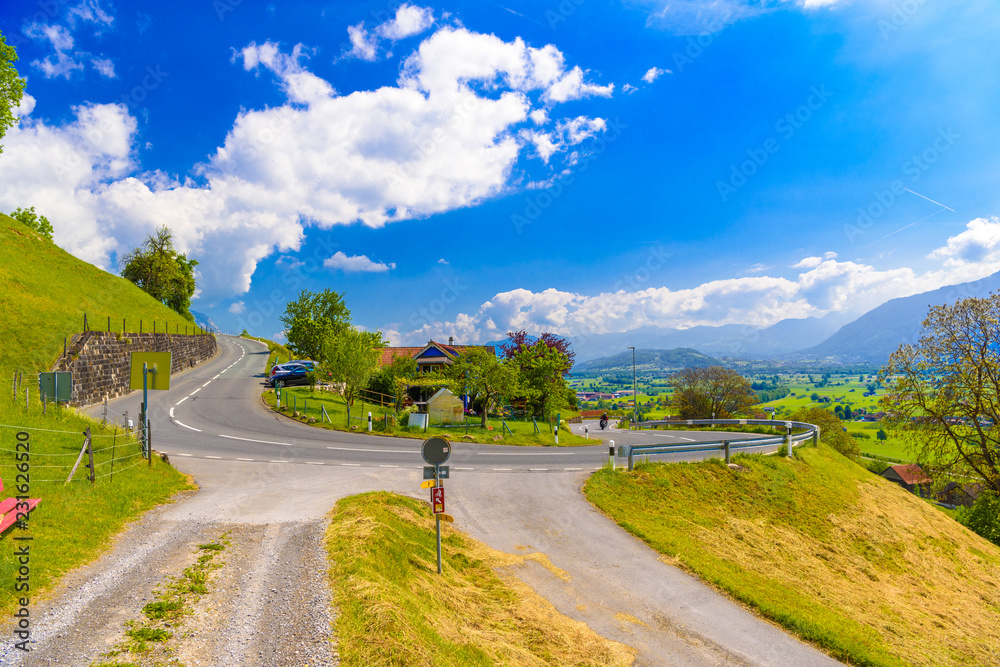 Fototapeta premium Curved road in Alps village, Grabs, Werdenberg, St. Gallen, Swit
