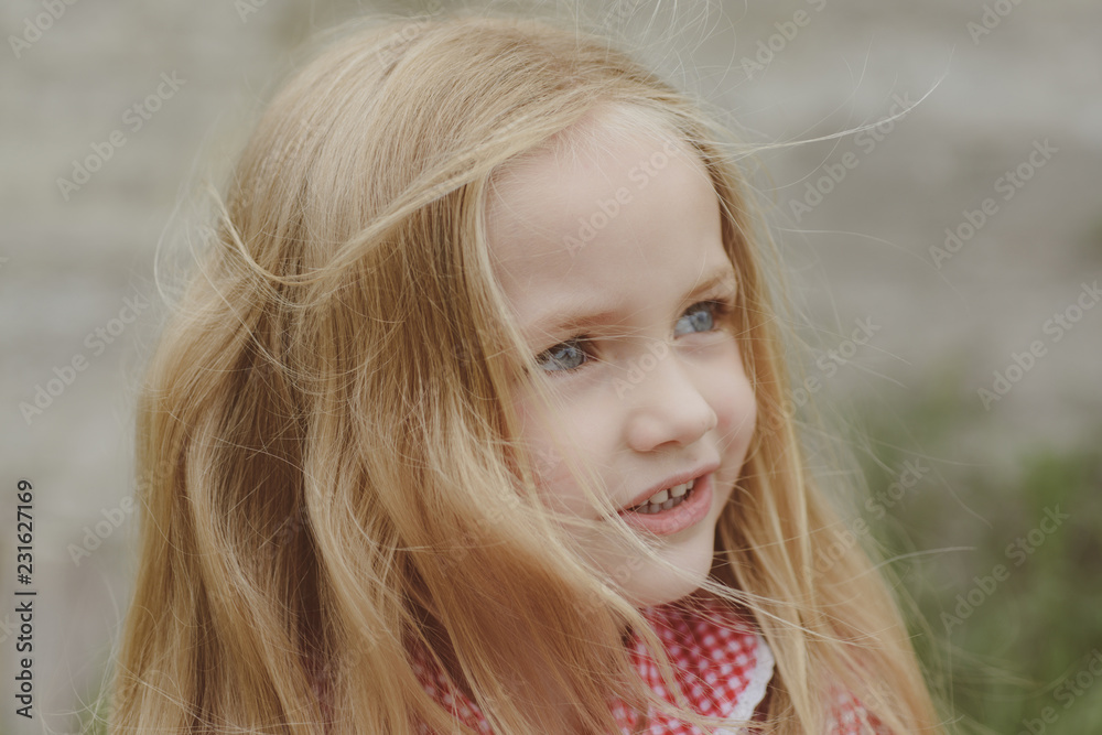 Fototapeta premium My hair grows and grows. Little girl with blond hair. Small girl wear long hair. Happy little child with adorable smile. Small child happy smiling. I enjoy being happy