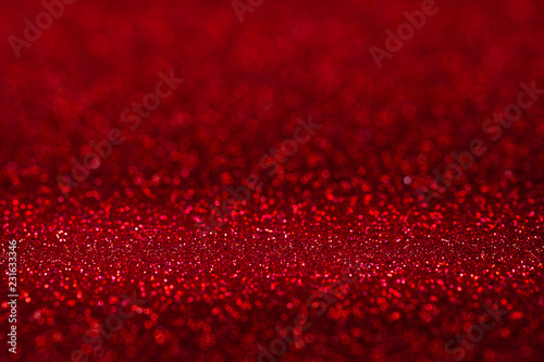 Abstract vivid red sparkling glitter wall and floor perspective background studio with blur bokeh.luxury holiday backdrop mock up for display of product.holiday festive greeting card.
