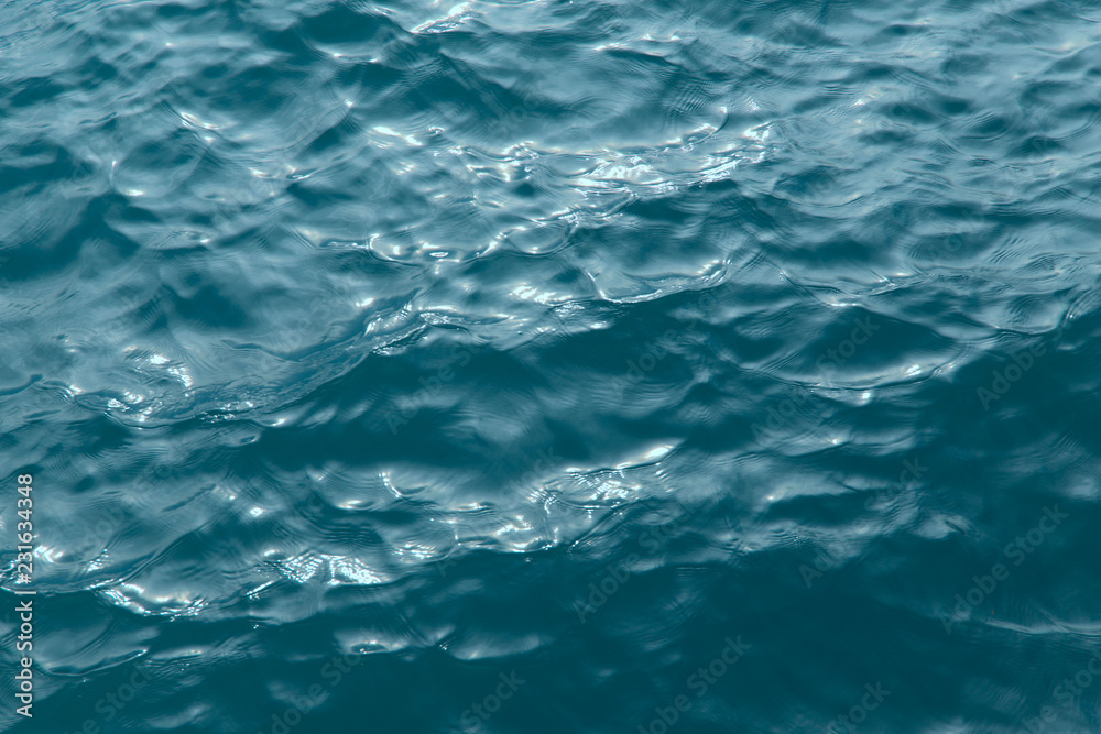 Abstract background water surface.Concept of travel and wellness.Crop cut, close-up, nobody