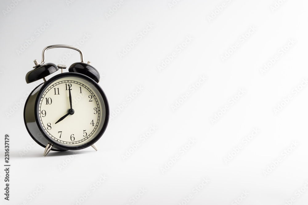 Alarm clock isolated on white background with selective focu Alarm clock isolated on white background with selective focu