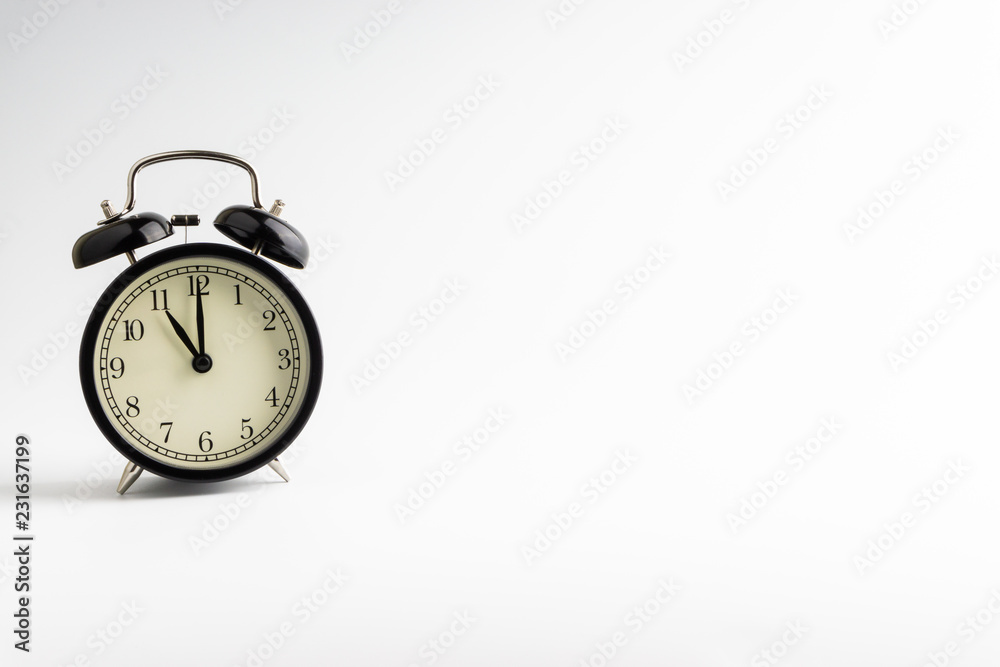 Alarm clock isolated on white background with selective focu Alarm clock isolated on white background with selective focu