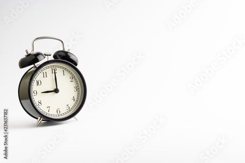 Alarm clock isolated on white background with selective focu photo