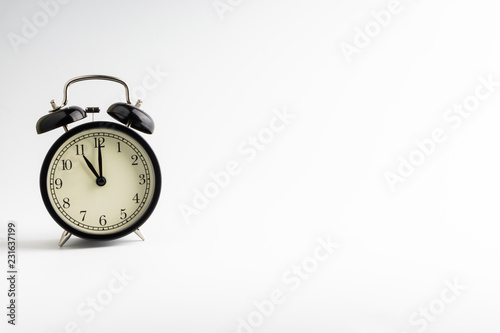 Alarm clock isolated on white background with selective focu