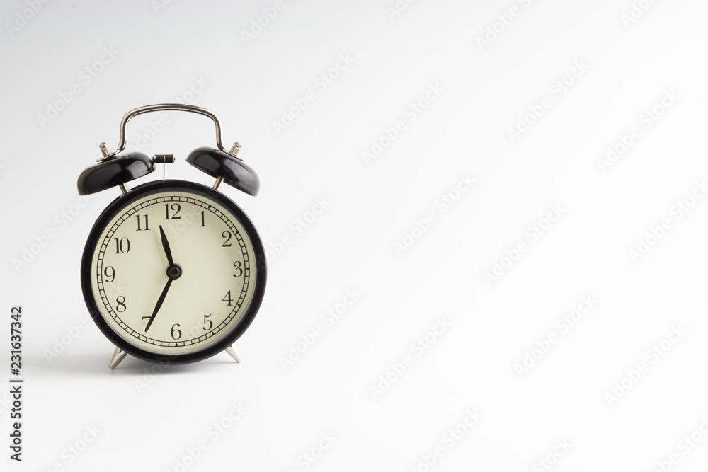 Alarm clock isolated on white background with selective focu Alarm clock isolated on white background with selective focu