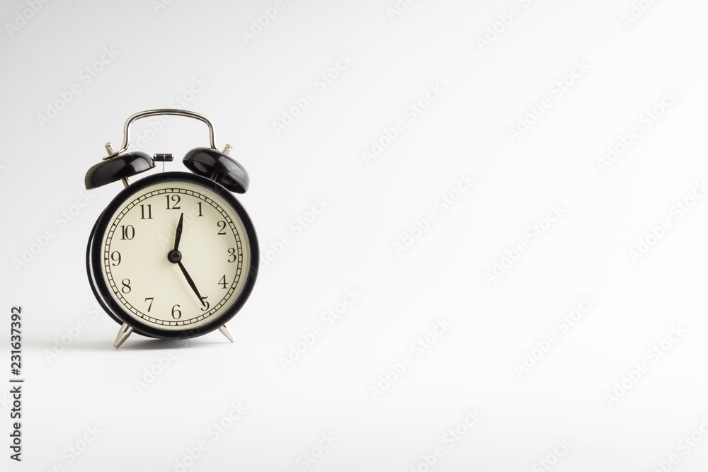 Alarm clock isolated on white background with selective focu Alarm clock isolated on white background with selective focu