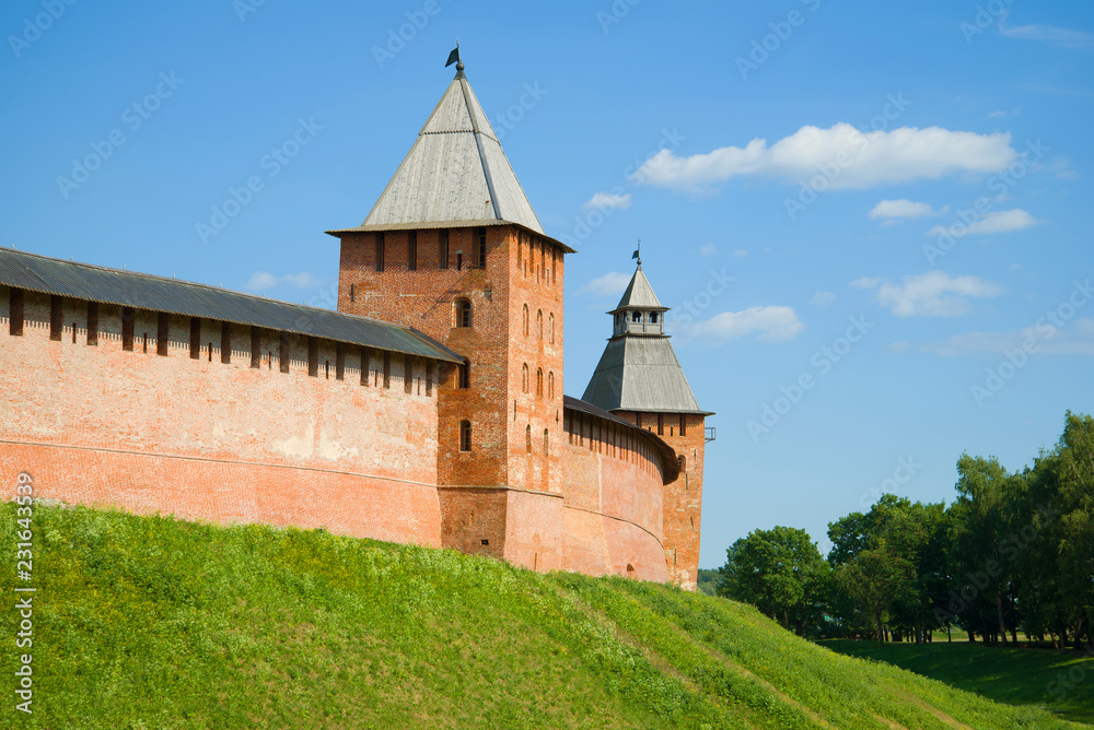 Two ancient towers of the Kremlin in Veliky Novgorod on a sunny July afternoon. Russia