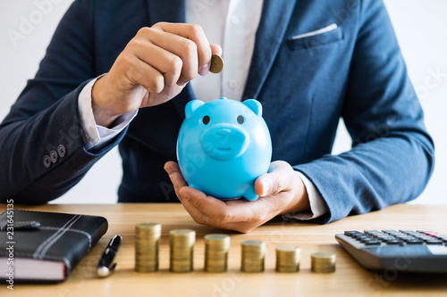 Coin stacks for step up growing business to profit and saving with piggy bank, Saving money for future plan and retirement fund concept