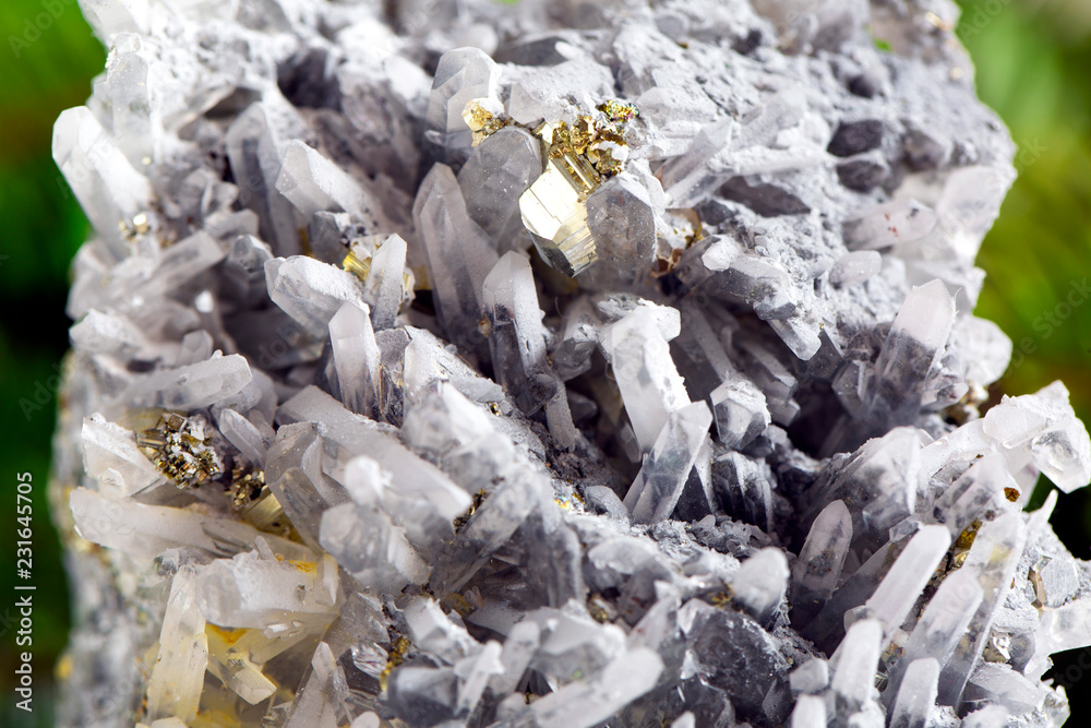 Macro shooting of natural gemstone. The raw mineral is pyrite, China. Isolated object on a white background.