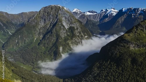 Timelapse of beautiful scenery from Mackinnon Pass on Milford Track, one of the most beautiful hikes in the world located in Fiordland, New Zealand, on a sunny summer day.