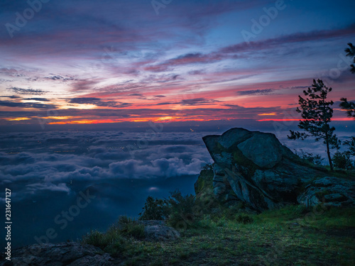Beautiful Sunrise Sky with Rocky cliff in the morning on Khao Luang mountain in Ramkhamhaeng National Park Sukhothai province Thailand