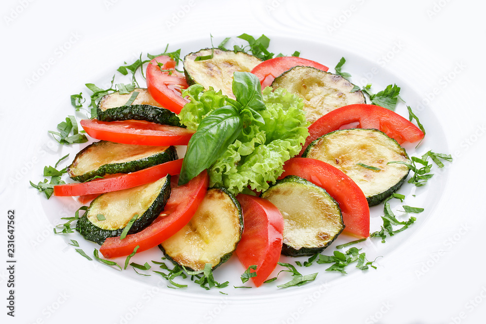 Fried vegetable marrows with greenery and tomatoes. Fried vegetable marrows with greenery and tomatoes.