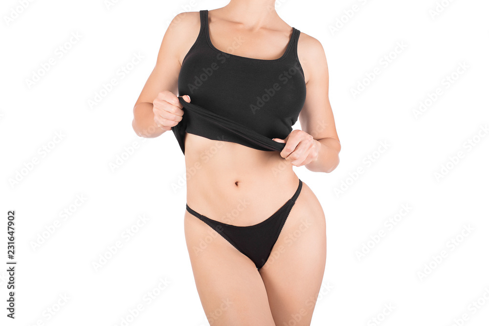 Female cropped fit body in black tank top and panties, isolated on white.  Stock Photo