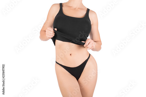 Female cropped fit body in black tank top and panties, isolated on white.