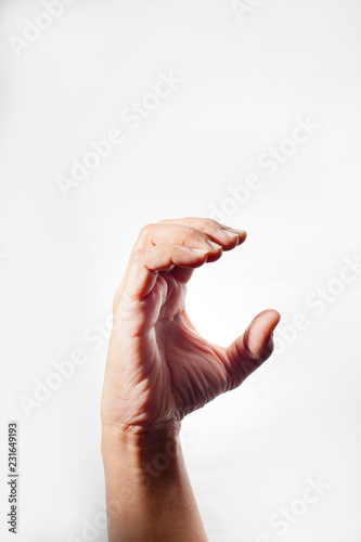 Hand with C character shape, isolated on white background. Symbol with hand.