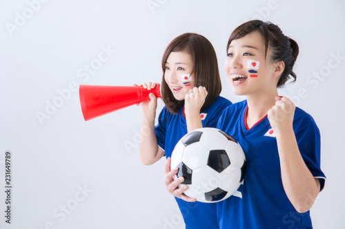 W杯・ワールドカップサッカーを応援するサッカーファン・サポーターの日本人女性 photo