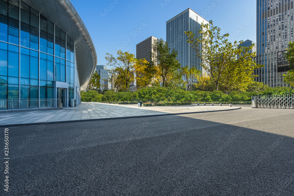 Fototapeta premium cityscape and skyline from empty asphalt road