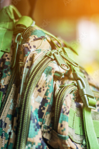 The part of camouflage backpack with zipper and lock 