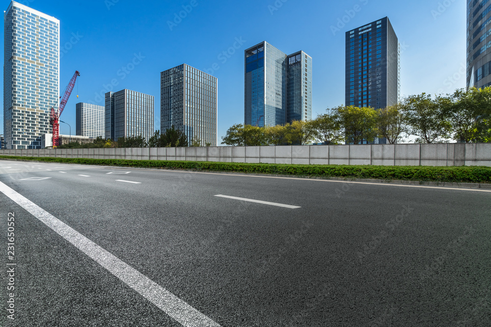 cityscape and skyline from empty asphalt road