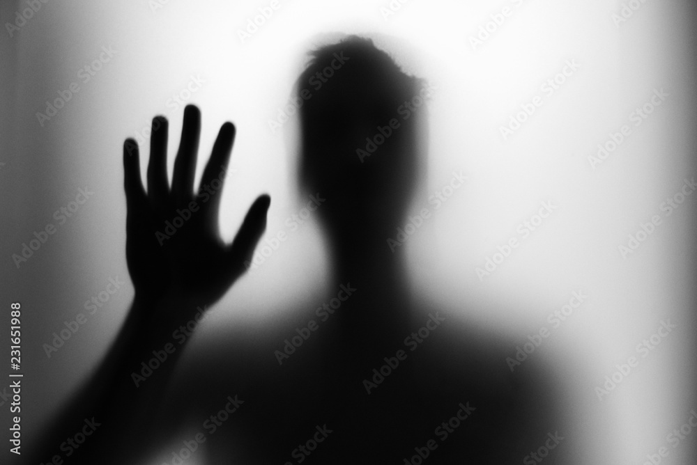 silhouette of hand on black background