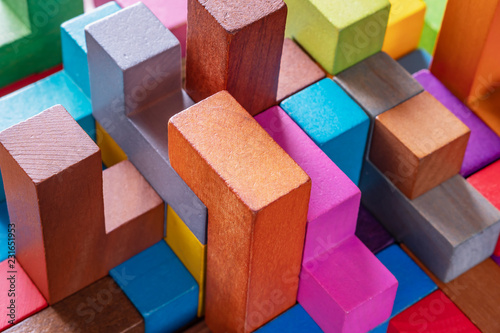 Geometric shapes on a wooden background, close-up.