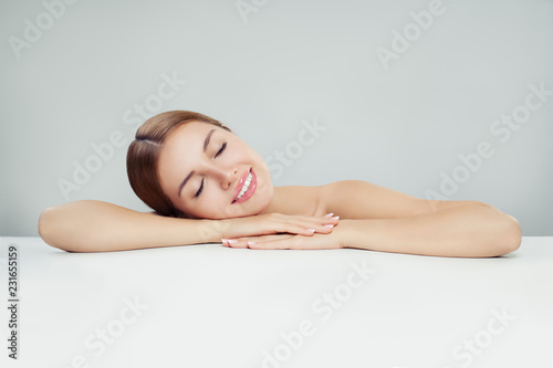 Beautiful woman with clear healthy skin on white background. Spa beauty