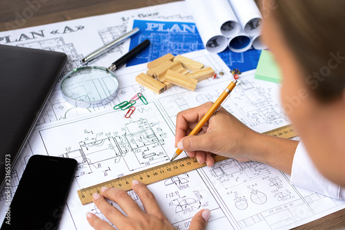 Architectural blueprints - drawings, pencil, calculator, calculations, plan, ruler, computer. Business and science.