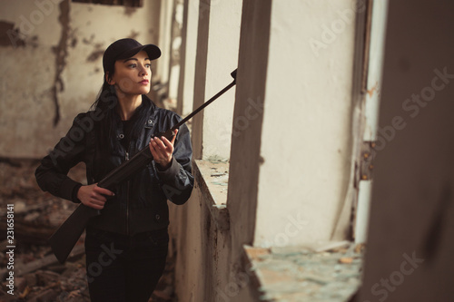 Wallpaper Mural airsoft woman soldier with a rifle playing strikeball In an abandoned old building Torontodigital.ca