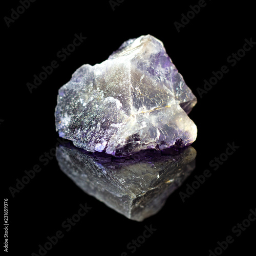 Natural untreated stone fluorite on a black backround