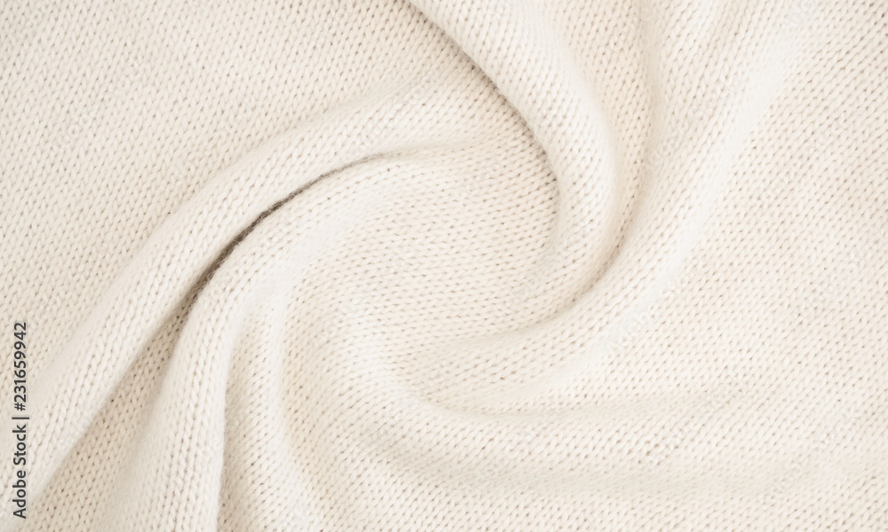 White knitted background. Sweater texture. Flat lay, top view, copy space White knitted background. Sweater texture. Flat lay, top view, copy space