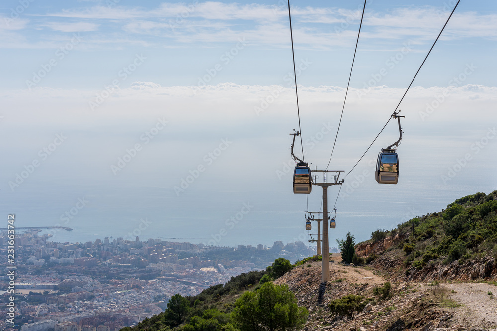 cable car in the mountains against the background of the city cable car in the mountains against the background of the city