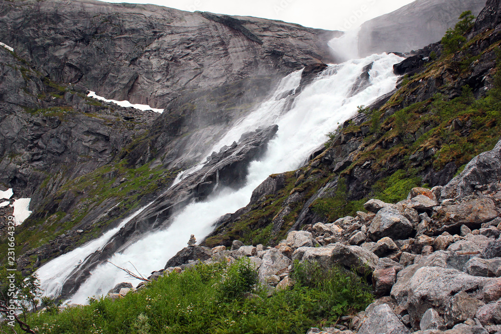 Sotefossen falls, the highest in cascade of four waterfalls in Husedalen valley, Kinsarvik, Norway Sotefossen falls, the highest in cascade of four waterfalls in Husedalen valley, Kinsarvik, Norway