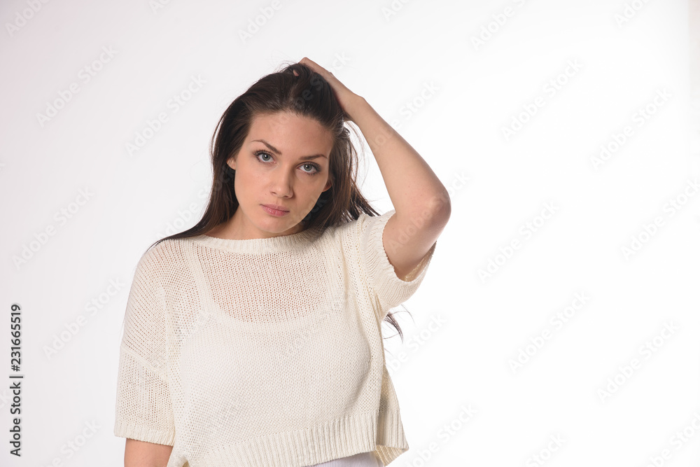 White caucasian girl posing emotionally isolated on background White caucasian girl posing emotionally isolated on background