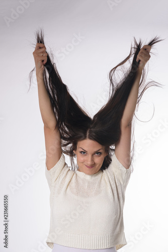 White caucasian girl posing emotionally isolated on background photo