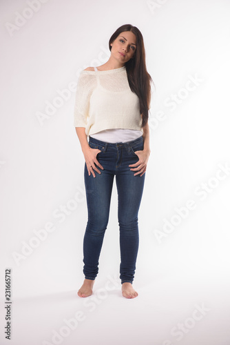White caucasian girl posing emotionally isolated on background