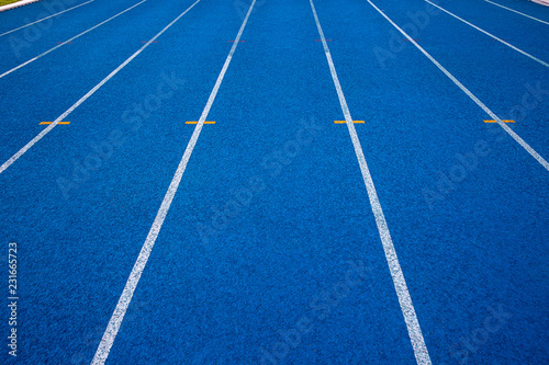 Blue running track in stadium. rubber running tracks in outdoor stadium. 