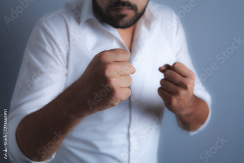 man holds his fists