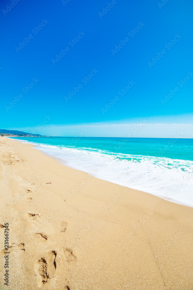 Beach, sand and blue ocean. Summer Background.  Copy space.